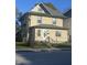 Charming two-story home featuring a fenced yard and traditional architectural details at 3241 N Capitol Ave, Indianapolis, IN 46208