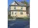 Charming two-story home featuring a fenced yard and traditional architectural details at 3241 N Capitol Ave, Indianapolis, IN 46208