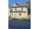 Charming two-story home featuring a fenced yard and traditional architectural details at 3241 N Capitol Ave, Indianapolis, IN 46208
