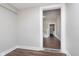 Hallway featuring laminate floors, neutral paint, and doorway to the rest of the home at 3241 N Capitol Ave, Indianapolis, IN 46208
