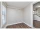 Hallway featuring laminate floors, neutral paint, and doorway to the rest of the home at 3241 N Capitol Ave, Indianapolis, IN 46208