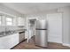Modern kitchen featuring a stainless steel refrigerator and newly renovated cabinets at 3241 N Capitol Ave, Indianapolis, IN 46208