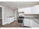 Renovated kitchen with stainless steel appliances, updated countertops, and ample cabinet space at 3241 N Capitol Ave, Indianapolis, IN 46208