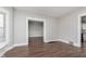 This living room features wood-look flooring and bright window at 3241 N Capitol Ave, Indianapolis, IN 46208