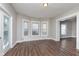 This living room features bright windows and wood-look flooring at 3241 N Capitol Ave, Indianapolis, IN 46208