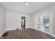 This living room features wood-look floors and glass doors at 3241 N Capitol Ave, Indianapolis, IN 46208