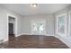 Bright living room with hardwood floors and glass french doors leading to the backyard at 3241 N Capitol Ave, Indianapolis, IN 46208