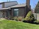 A well-maintained townhouse with a brick facade and manicured front lawn at 346 E St Clair E St, Indianapolis, IN 46202