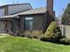 Well-maintained townhouse with brick facade, landscaped front yard, and covered porch at 346 E St Clair E St, Indianapolis, IN 46202