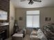 Comfortable living room featuring a brick fireplace and a large window at 346 E St Clair E St, Indianapolis, IN 46202