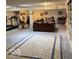 Spacious basement area with exercise equipment, desk, shelves, and a light-colored rug at 3504 Inverness Blvd, Carmel, IN 46032