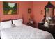 Comfortable bedroom with a bed, ornate vanity and dresser, and a painting above the bed at 3504 Inverness Blvd, Carmel, IN 46032