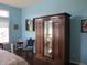 Spacious bedroom showcasing an elegant wardrobe with mirrored doors and a cozy reading nook at 3504 Inverness Blvd, Carmel, IN 46032