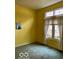 Bright bedroom featuring yellow walls, soft carpeting, and a window offering natural light at 3504 Inverness Blvd, Carmel, IN 46032