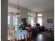 Bright dining area featuring a chandelier, garden views, and a table with chairs at 3504 Inverness Blvd, Carmel, IN 46032