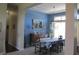 Elegant dining room with blue walls, chandelier, and a window with natural light for a warm ambiance at 3504 Inverness Blvd, Carmel, IN 46032