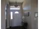 Inviting foyer with elegant lighting, neutral walls, and a classic front door design at 3504 Inverness Blvd, Carmel, IN 46032