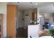 Open kitchen area featuring granite countertops, stainless steel appliances, and wood cabinets at 3504 Inverness Blvd, Carmel, IN 46032