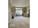 Bright living room featuring a large window with curtains and natural light at 3504 Inverness Blvd, Carmel, IN 46032