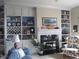Inviting living room showcasing built-in shelving and a cozy fireplace with mantel at 3504 Inverness Blvd, Carmel, IN 46032