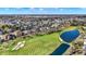 Breathtaking aerial view of a golf course highlighting the lush green landscape and surrounding community on a sunny day at 3582 Pete Dye Blvd, Carmel, IN 46033