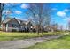 Gorgeous exterior view showcasing the home's landscaping and proximity to the neighborhood walkway at 3582 Pete Dye Blvd, Carmel, IN 46033