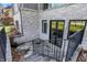 View of walkout basement entrance, featuring glass door, and stone steps and exterior at 3582 Pete Dye Blvd, Carmel, IN 46033