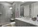 Bathroom featuring tiled floors, shower, and vanity with marble countertop at 3582 Pete Dye Blvd, Carmel, IN 46033