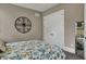 Bedroom featuring white trim, a decorative wall hanging, and ensuite bath at 3582 Pete Dye Blvd, Carmel, IN 46033