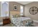 Bedroom featuring white trim, a decorative wall hanging, and two windows at 3582 Pete Dye Blvd, Carmel, IN 46033