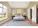 Large primary bedroom with vaulted ceiling, ample lighting, and an attached bathroom at 3582 Pete Dye Blvd, Carmel, IN 46033
