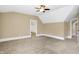 Neutral bedroom with carpet, a ceiling fan, and a doorway leading to another room in the house at 3582 Pete Dye Blvd, Carmel, IN 46033
