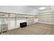 Spacious, organized walk-in closet with shelving and a decorative cabinet at 3582 Pete Dye Blvd, Carmel, IN 46033