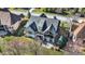Aerial view of the backyard featuring a well-maintained lawn and elegant outdoor living space of the home at 3582 Pete Dye Blvd, Carmel, IN 46033