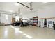 Spacious garage with epoxy flooring, car, golf cart and ample storage and workbench areas at 3582 Pete Dye Blvd, Carmel, IN 46033