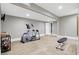 Well-lit home gym equipped with fitness machines, and neutral flooring for a comfortable exercise environment at 3582 Pete Dye Blvd, Carmel, IN 46033