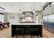 Spacious kitchen with double islands, gray cabinets, stainless appliances, and modern lighting at 3582 Pete Dye Blvd, Carmel, IN 46033
