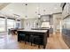 Open-concept kitchen with large island, stainless steel appliances, and hardwood floors at 3582 Pete Dye Blvd, Carmel, IN 46033