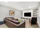 The basement living room includes a media center with built-in shelving at 3582 Pete Dye Blvd, Carmel, IN 46033