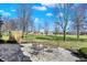 Inviting backyard patio with a table and chairs, set in a lush green landscape at 3582 Pete Dye Blvd, Carmel, IN 46033