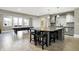A wet bar features stainless appliances, pendant lighting, and access to the patio at 3582 Pete Dye Blvd, Carmel, IN 46033