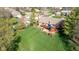 Aerial view features large backyard with a deck, seating area, and manicured landscaping at 4063 Millstream Rd, Greenwood, IN 46143