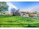 Expansive grassy backyard of a brick home, ideal for outdoor enjoyment and activities at 4063 Millstream Rd, Greenwood, IN 46143