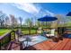 Outdoor deck with patio furniture is perfect for entertaining with scenic backyard views and mature trees at 4063 Millstream Rd, Greenwood, IN 46143