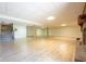 Basement offering wood flooring, fireplace, staircase access to the main floor, and overhead lighting at 4063 Millstream Rd, Greenwood, IN 46143