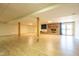 Spacious finished basement with hardwood floors, brick fireplace, and French doors providing plenty of light at 4063 Millstream Rd, Greenwood, IN 46143