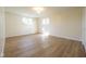 Bedroom featuring hard wood floors, neutral paint, natural light from the windows, and an overhead light at 4063 Millstream Rd, Greenwood, IN 46143