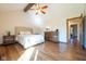 Inviting bedroom with vaulted ceilings, hardwood floors, and a cozy bed and dresser at 4063 Millstream Rd, Greenwood, IN 46143