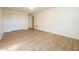Bright bedroom featuring wood-look flooring and ample closet space at 4063 Millstream Rd, Greenwood, IN 46143