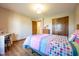 Bright bedroom featuring hardwood floors, closet, and natural light perfect for a growing Gathering at 4063 Millstream Rd, Greenwood, IN 46143